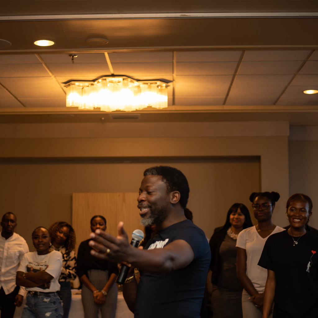 A speaker teaching from an open Bible at the retreat
